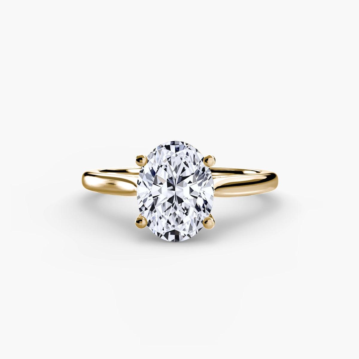 Harper oval solitaire diamond engagement ring in yellow gold by Wave Jewellery