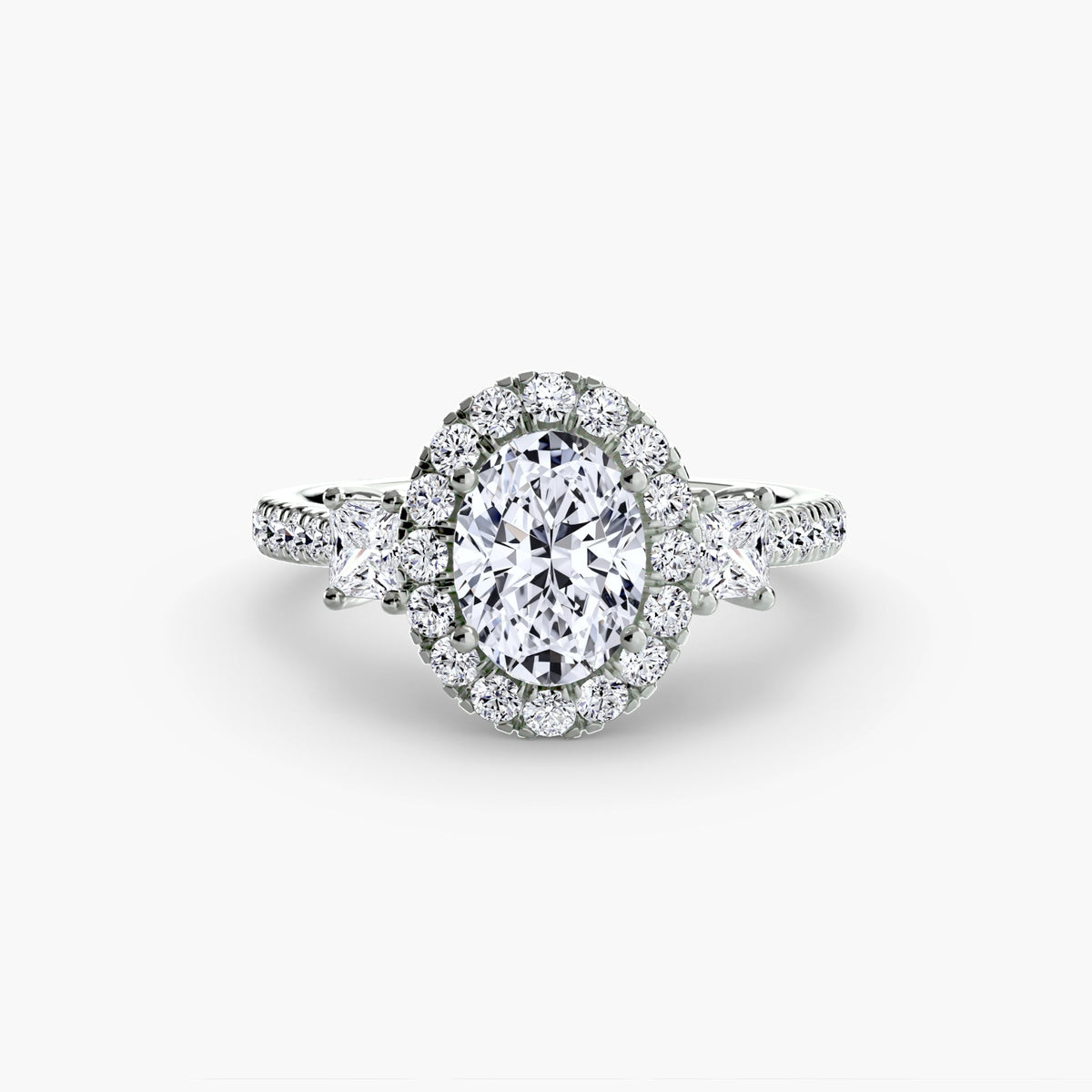Oval three-stone halo diamond engagement ring by Wave Jewellery