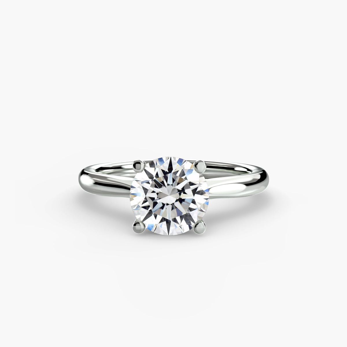 Round brilliant solitaire diamond engagement ring in white gold by Wave Jewellery